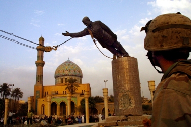 Toppling of the statue of Saddam Hussein. The invasion was sparked by a belief Saddam was developing nuclear weapons. This allegation was later proven false. 